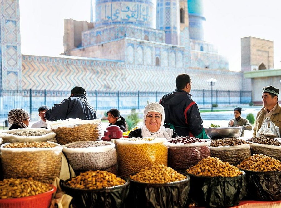 Dry fruit market in Uzbekistan with Samarkand architecture